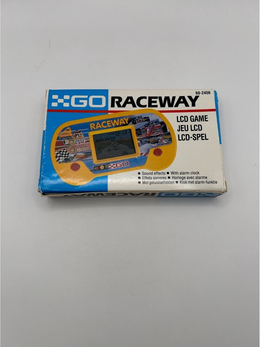 XGO Raceway Handheld Electronic LCD Game Auto Racing Yellow Blue White 1990s